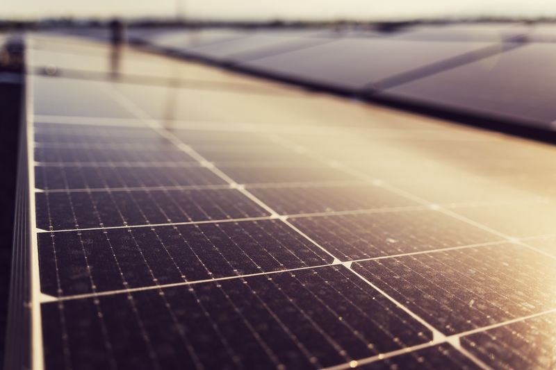 Close-up of black solar panels in sunlight